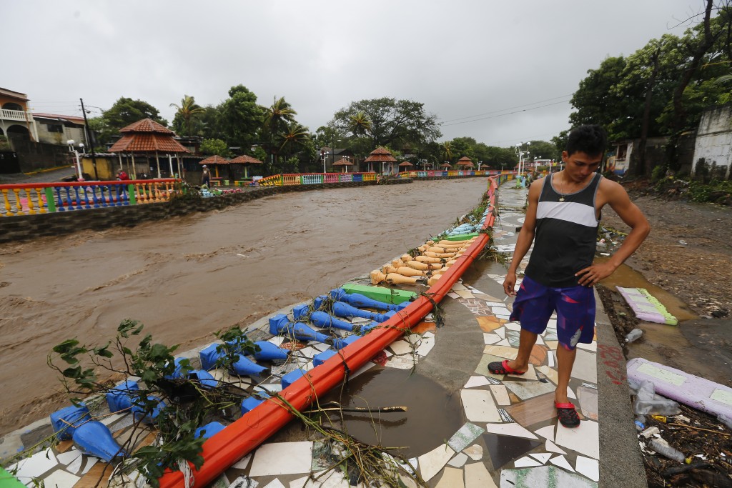 A resident looks at damages caused by the overflowing of the Masachapa River following the passage of Tropical Storm Nate in the city of Masachapa, about 60km from the city of Managua on October 5, 2017. A tropical storm sliding north along Central America Thursday has unleashed heavy rains killing at least nine people in Costa Rica and Nicaragua, with forecasters predicting it could strengthen into a hurricane headed for the United States. / AFP PHOTO / INTI OCON